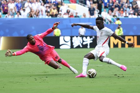 Bukayo Saka #7 of England scores his team's third goal against Mike Maignan #16