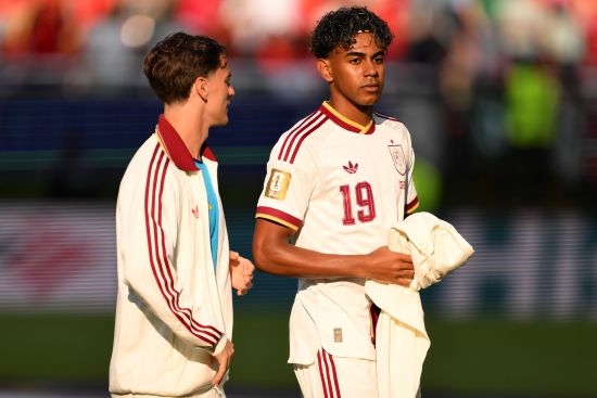 Lamine Yamal #19 of Spain talk to his team mate Gavi